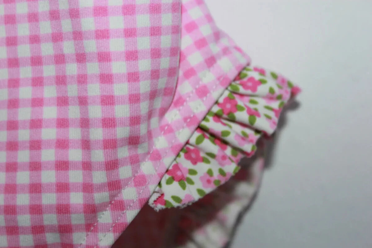 tweedehands roze-wit geruit badpak van jacadi in maat 104