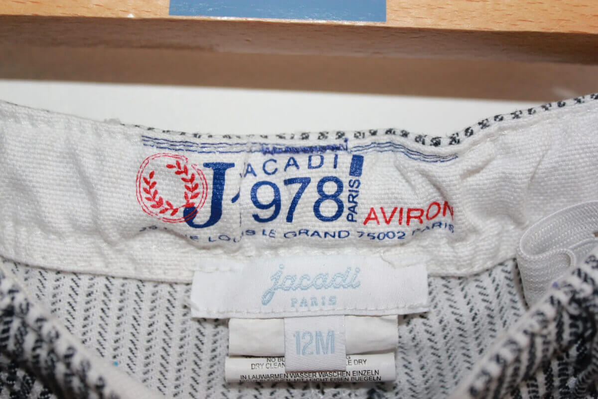 tweedehands katoenen donkerblauw met wit gestreepte lange broek van jacadi, maat 74 voor een baby jongen